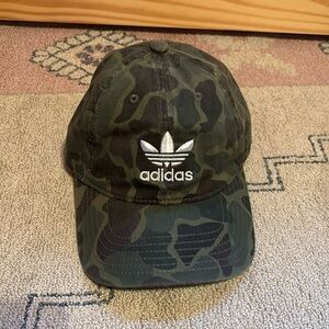 Camo print Adidas hat. Never worn, like new. Adjustable hat with white logo.